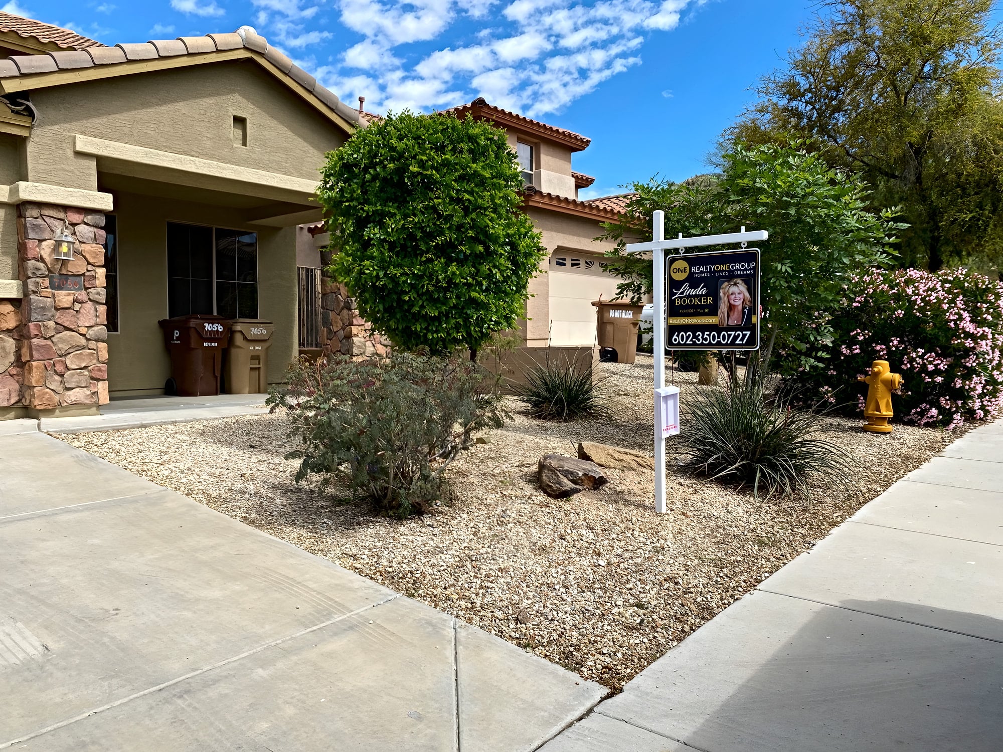 Front yard gravel and shrubs tidied for a home sale